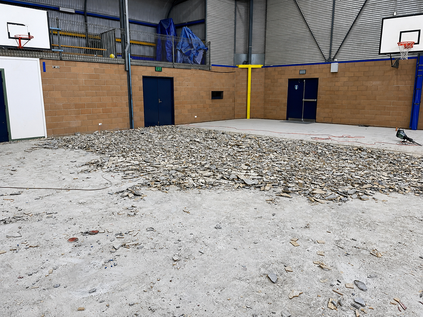 Commercial floor repair in a basketball court