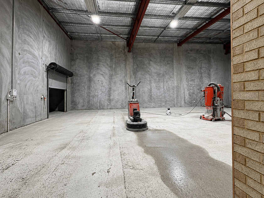 Concrete floor grinding in a commercial warehouse