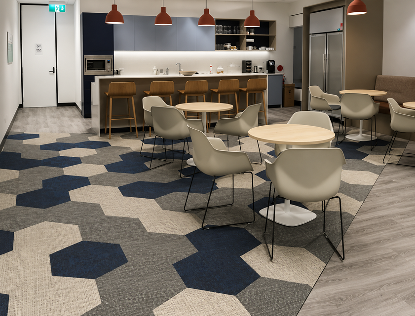 Woven vinyl flooring in a commercial office breakout area